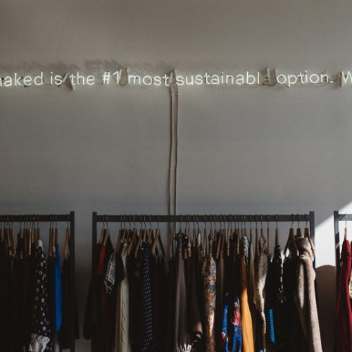 clothes hanging in boutique