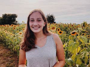 woman in sunflower field