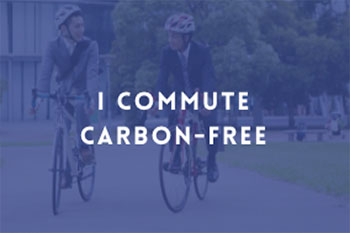 image of two men riding bicycles with text overlay "I commute carbon-free"