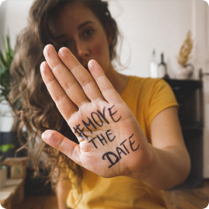 woman with #MoveTheDate hand