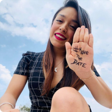 smiling woman with #MoveTheDate hand