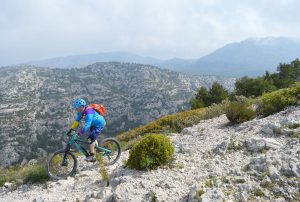 man biking in Calanques National Park, France